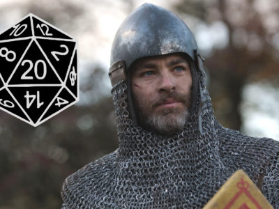 Chris Pine in chainmail next to a d20