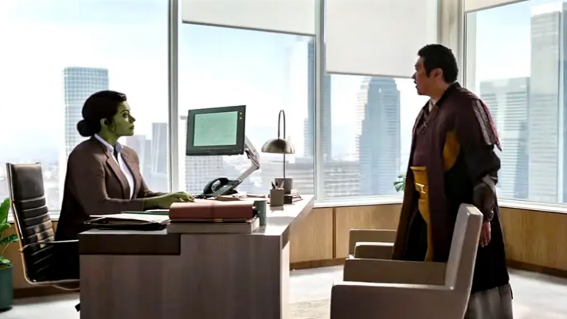 Tatiana Maslany as Jennifer Walters and Benedict Wong as Wong in She-Hulk: Attorney at Law