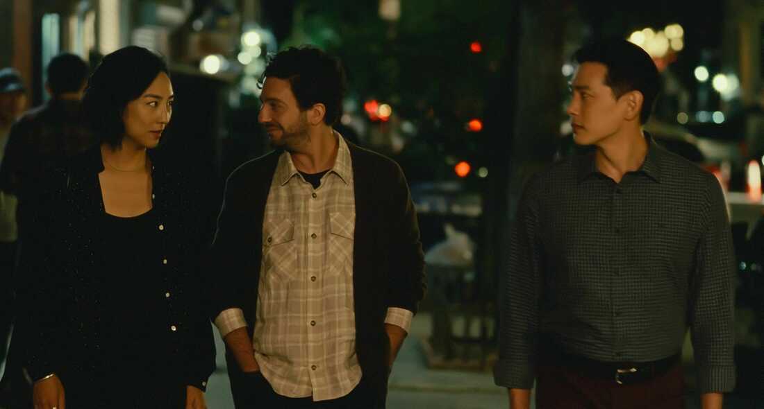 Nora (Greta Lee), Arthur (John Magaro) and Hae Sung (Teo Yoo) walking in NYC.